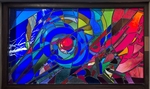 Abstract stained-glass artwork in a dark frame featuring a vivid blue spiral surrounding a bright red center. Angular pieces of blue, turquoise, green, pink, yellow, and red glass radiate outward, with white lightning-like streaks near the top against a deep blue background. by Stephen Wilson