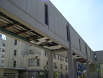 View of the damaged underside of the elevated walkway connecting the former LSU Health School of Nursing building to its parking garage. by LSU Health Sciences Center - New Orleans